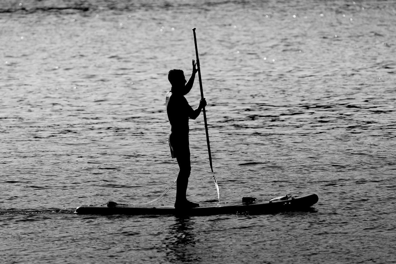 Man Standing on a Paddleboard |