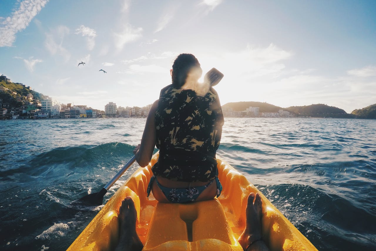 people riding kayak | 