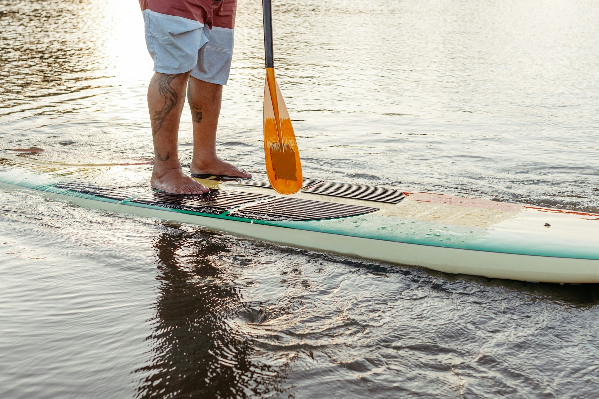 man paddleboarding |